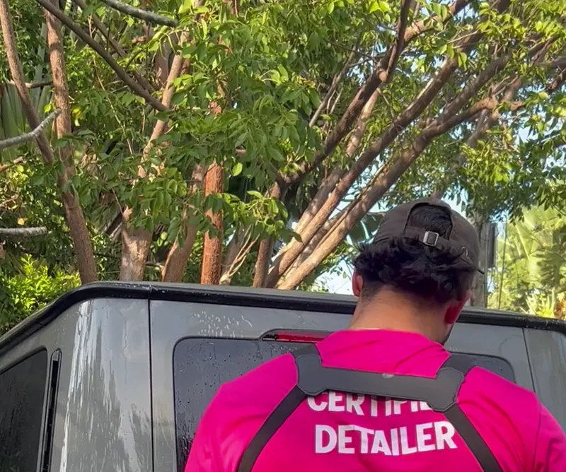 The Foam Club certified detailer at work beside a customer’s G-Class
